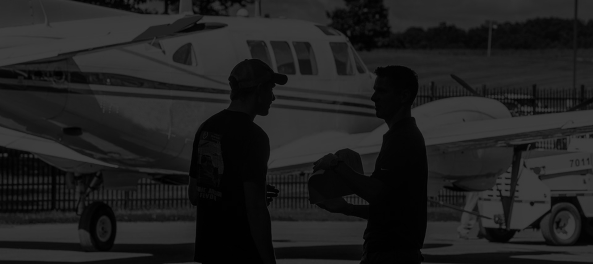 Dynamic Aviation employees in front of King Air