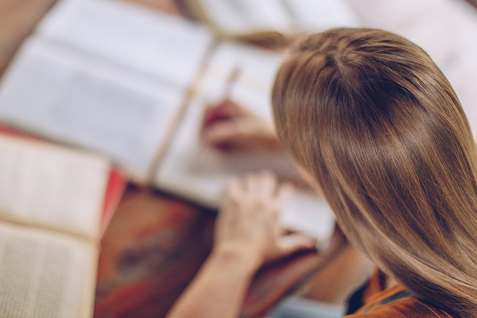 Student studying in the backyard