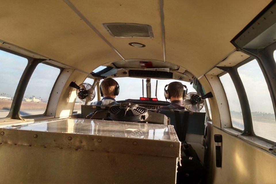 Pilots in cockpit preparing for flight