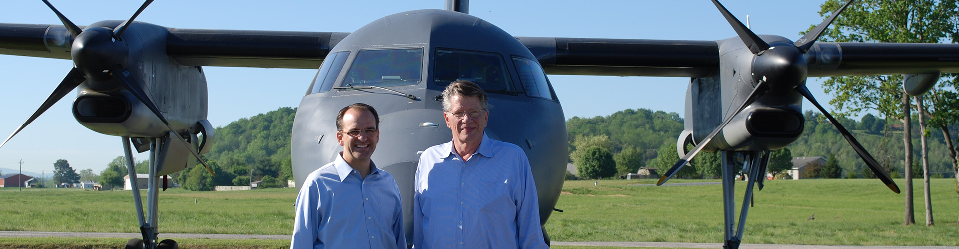 Mike and Karl Stoltzfus in front of DHC-8 100