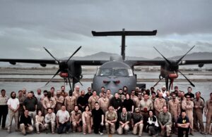 Group in front of Dash 8