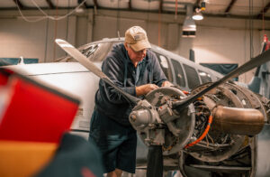 A&P working on King Air 90 engine