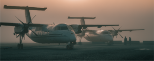 Dash 8s on the ramp. Foggy morning.