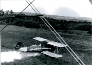 Chris Stoltzfus spraying in Travel Air