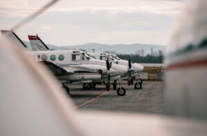 Line of King Air 90s on the ramp.