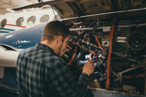 A&P Mechanic working on a King Air 200
