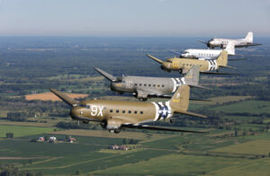 5 c-47 / dc-3 variants flying in formation